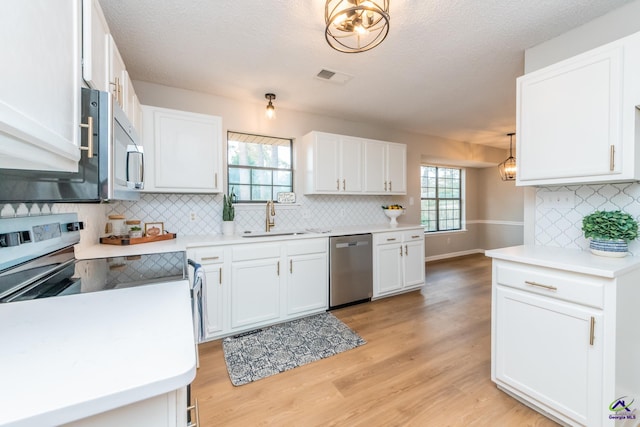 kitchen featuring white cabinetry and stainless steel appliances