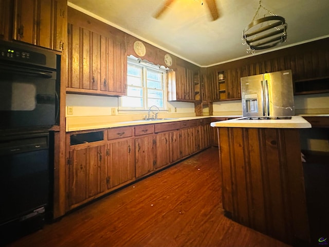 kitchen featuring ornamental molding, black appliances, sink, and dark hardwood / wood-style flooring