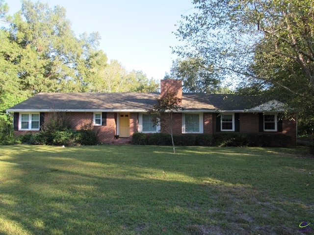 ranch-style home with a front lawn