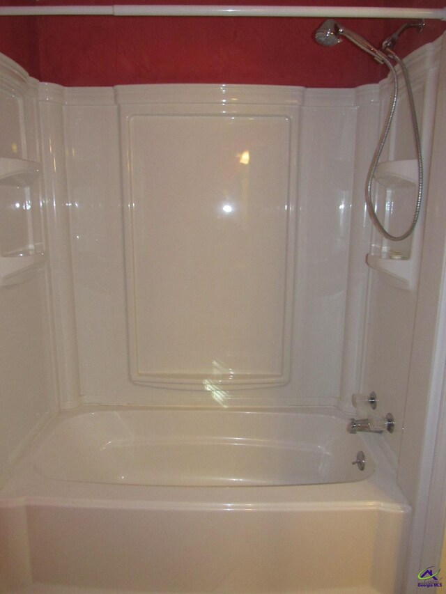 bathroom featuring washtub / shower combination