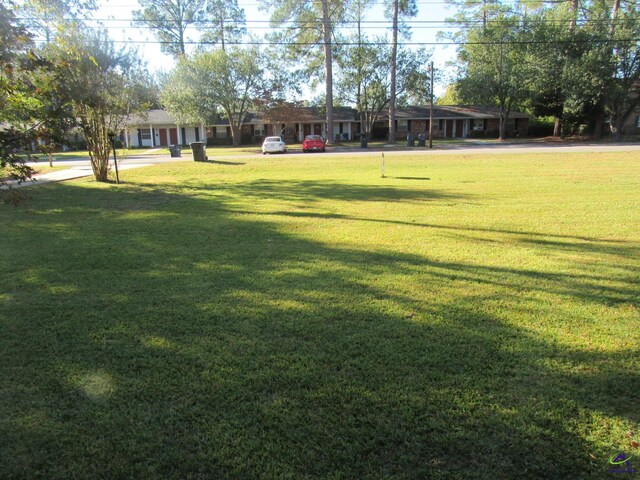 view of home's community with a lawn