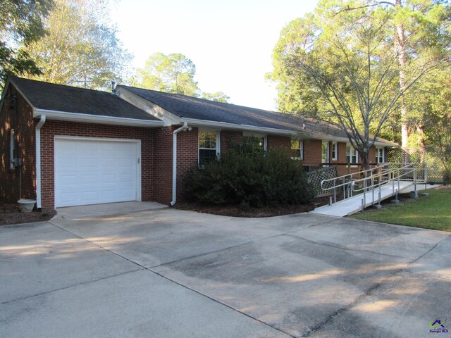 view of side of home featuring a garage