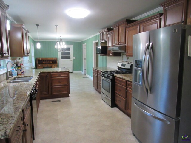 kitchen featuring light stone counters, a chandelier, stainless steel appliances, sink, and decorative light fixtures