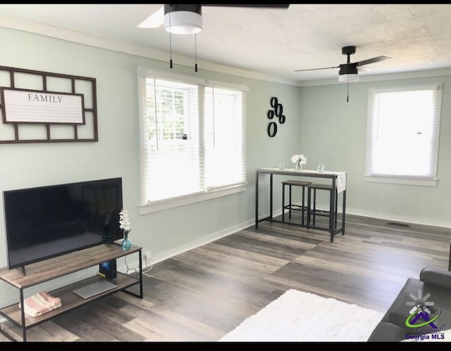5415 Beulah Ave, Eastman, GA 31023 - living room featuring ceiling fan, wood finished floors, crown molding, and baseboards