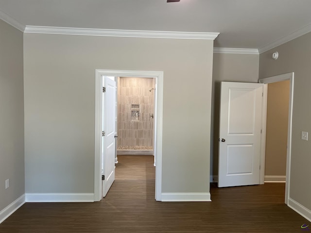 interior space with ornamental molding and dark hardwood / wood-style flooring