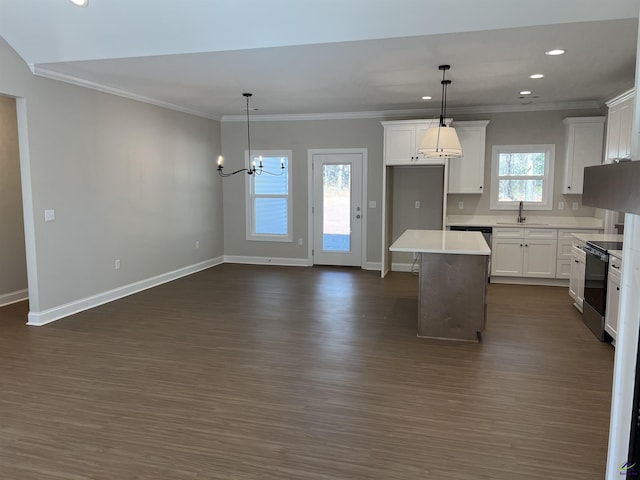 kitchen with range with electric cooktop, white cabinetry, a center island, and hanging light fixtures