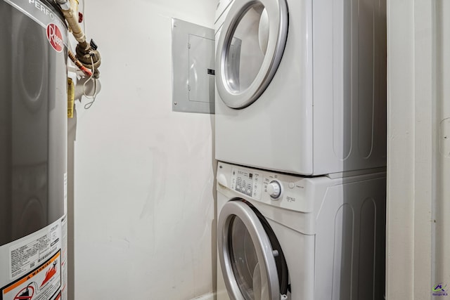 laundry area featuring stacked washer and dryer and gas water heater