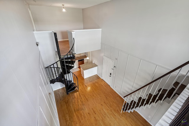 stairs with hardwood / wood-style floors