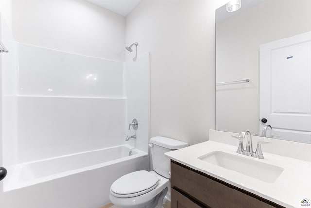 full bath featuring  shower combination, vanity, and toilet