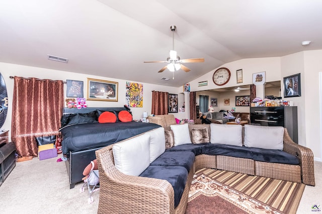 bedroom with ceiling fan, carpet flooring, and lofted ceiling