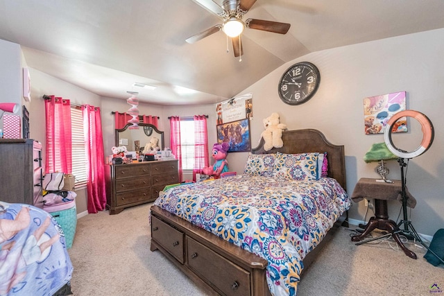 bedroom featuring lofted ceiling, light colored carpet, and ceiling fan