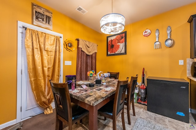 dining room featuring a chandelier