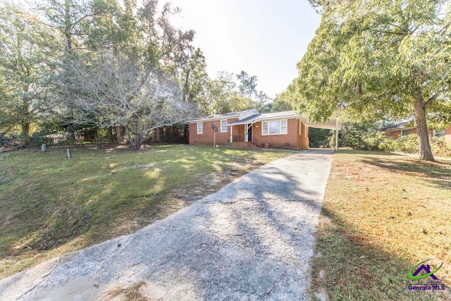 ranch-style house with a front lawn and a carport