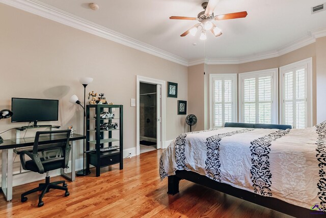 bedroom with ceiling fan, ornamental molding, light hardwood / wood-style flooring, and ensuite bath