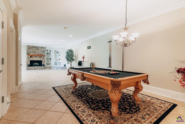 recreation room with billiards, light tile patterned flooring, a stone fireplace, and built in features