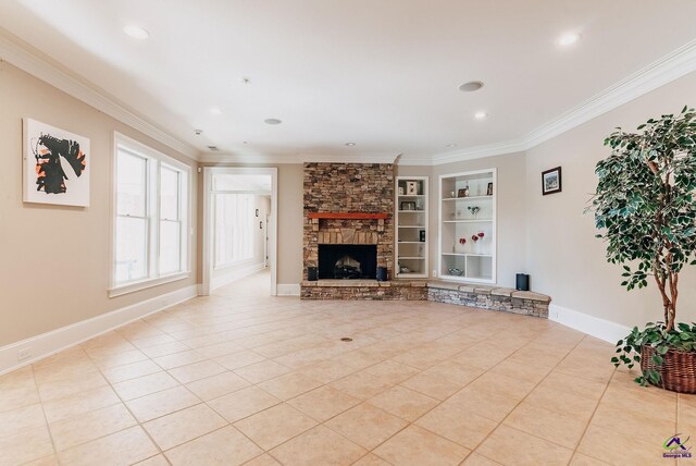 unfurnished living room with ornamental molding, light tile patterned flooring, a fireplace, and built in shelves