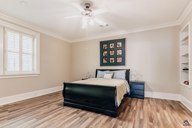 bedroom featuring ceiling fan, ornamental molding, and light wood-type flooring