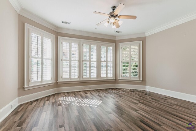 empty room featuring crown molding, dark hardwood / wood-style floors, and ceiling fan