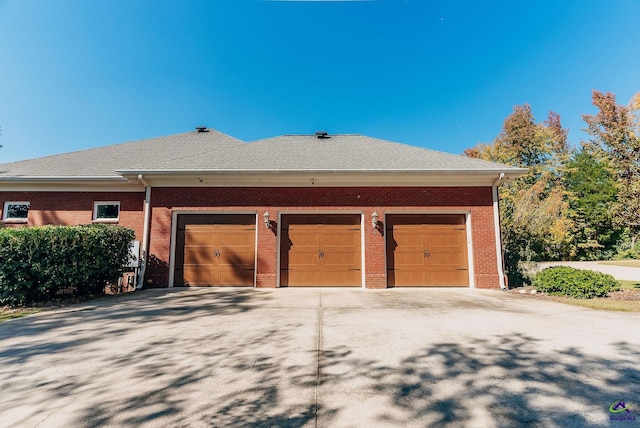 view of side of property featuring a garage