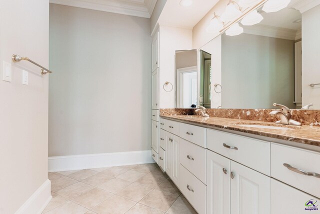 bathroom with vanity, crown molding, and tile patterned floors