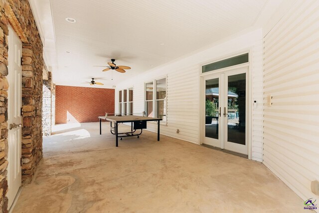 view of patio with french doors and ceiling fan