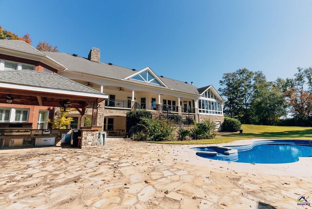 view of pool featuring a patio, area for grilling, a lawn, and ceiling fan