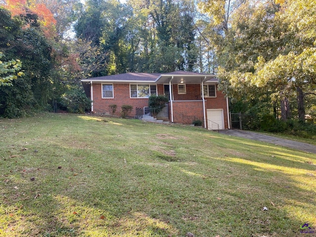 ranch-style home featuring a garage and a front lawn