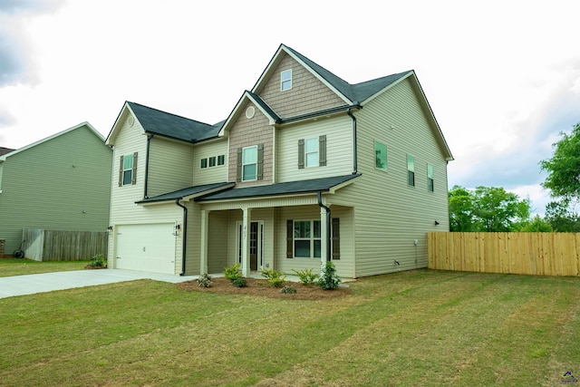 view of front facade featuring a front yard and a garage