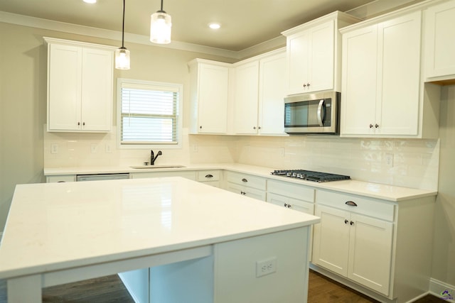 kitchen featuring a fireplace, dark wood finished floors, and white cabinetry