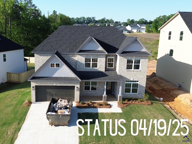 view of front of property featuring a patio area and roof with shingles