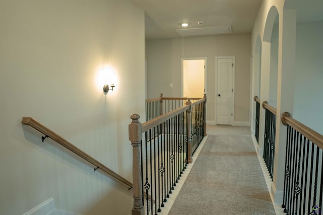 spare room featuring light colored carpet, a ceiling fan, visible vents, and a tray ceiling