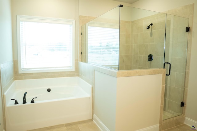 full bathroom featuring a sink, tile patterned floors, baseboards, and double vanity