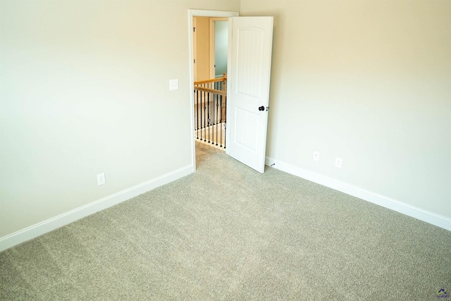 clothes washing area with washer hookup, electric dryer hookup, cabinet space, a sink, and baseboards