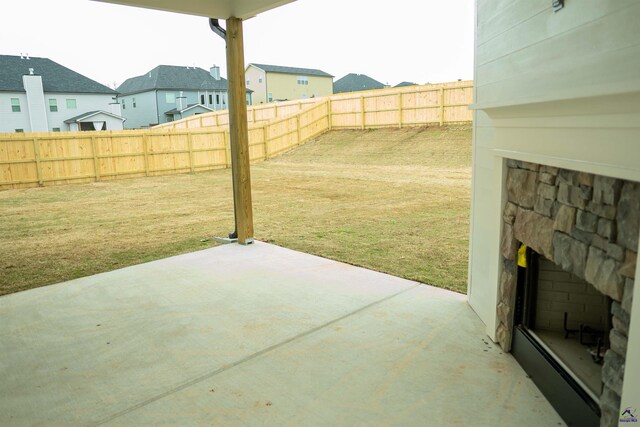 back of house featuring a patio, a fenced backyard, a chimney, a gate, and central AC unit