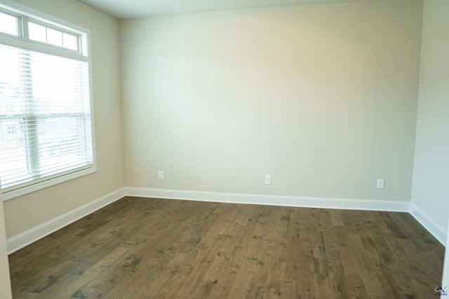 unfurnished dining area with an inviting chandelier, stairs, a decorative wall, dark wood-type flooring, and arched walkways