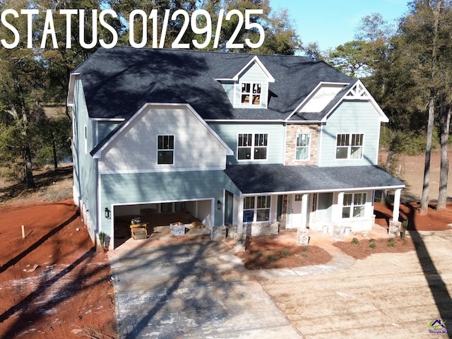 view of front of house with a garage and a porch