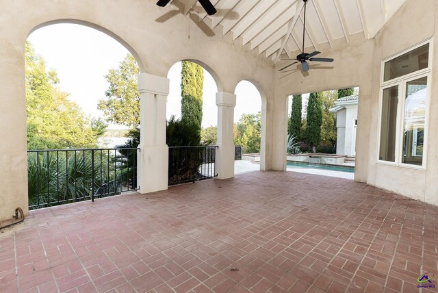 view of patio / terrace featuring a fenced in pool and ceiling fan