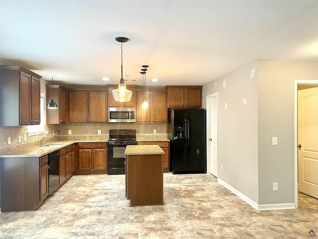 kitchen featuring light stone counters, tasteful backsplash, a kitchen island, and black appliances