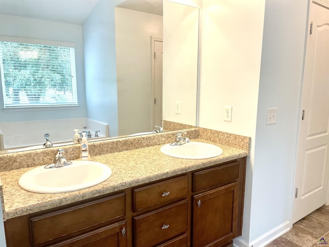 full bath featuring double vanity and a sink