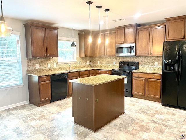 kitchen featuring light stone countertops, black appliances, and visible vents