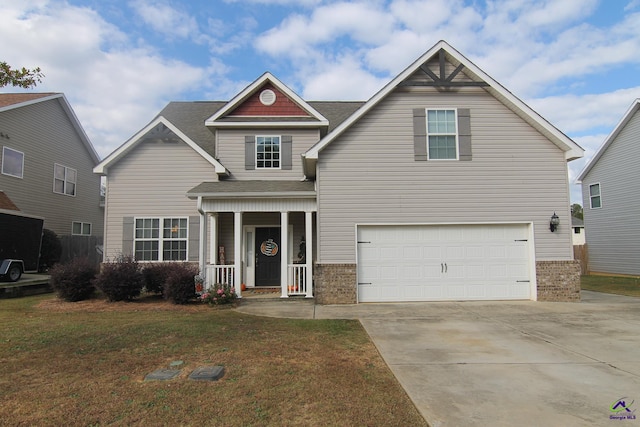 view of front of home with a front yard and a garage