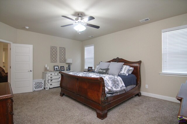 bedroom with light colored carpet and ceiling fan