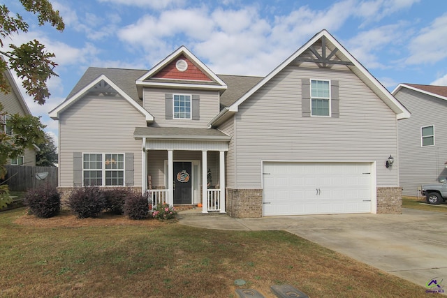 craftsman-style home featuring a front lawn and a garage