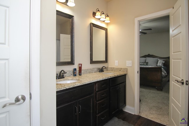 204 Tyndall Way, Perry, GA 31069 - full bath featuring wood finished floors, double vanity, and baseboards