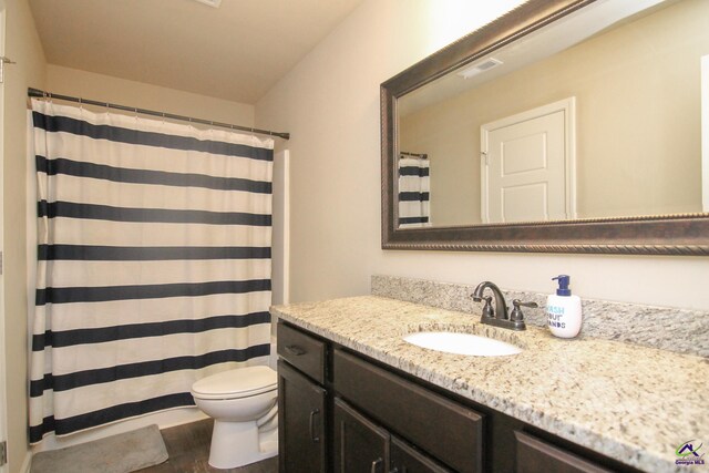 bathroom with vanity, curtained shower, toilet, and wood-type flooring