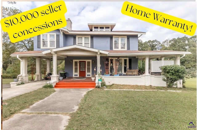 429 N Dooly St, Montezuma, GA 31063 - view of front of house featuring a porch, a front lawn, and a chimney