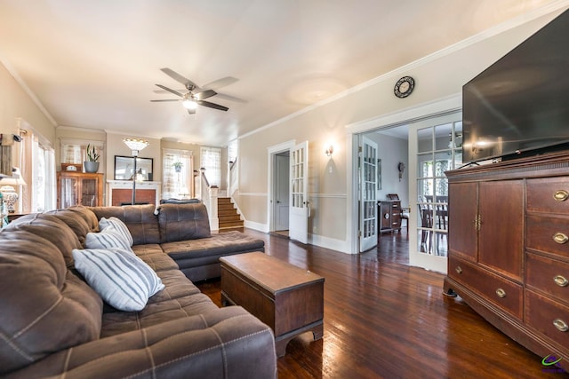 living room featuring dark wood-type flooring, crown molding, french doors, and ceiling fan