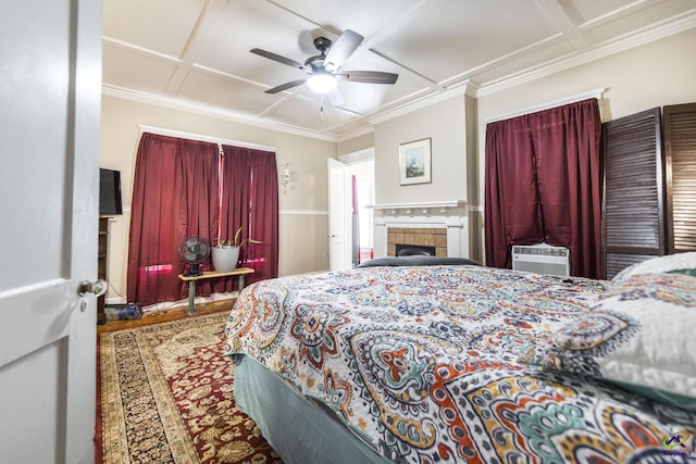429 N Dooly St, Montezuma, GA 31063 - bedroom featuring coffered ceiling, crown molding, cooling unit, wood finished floors, and a ceiling fan