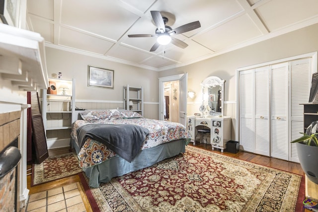 429 N Dooly St, Montezuma, GA 31063 - bedroom with coffered ceiling, a ceiling fan, a closet, and wood finished floors