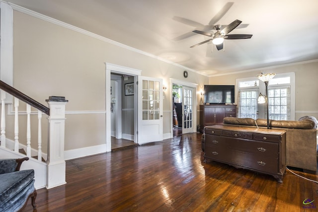 429 N Dooly St, Montezuma, GA 31063 - living room featuring dark wood-style floors, ornamental molding, a ceiling fan, stairs, and a chandelier